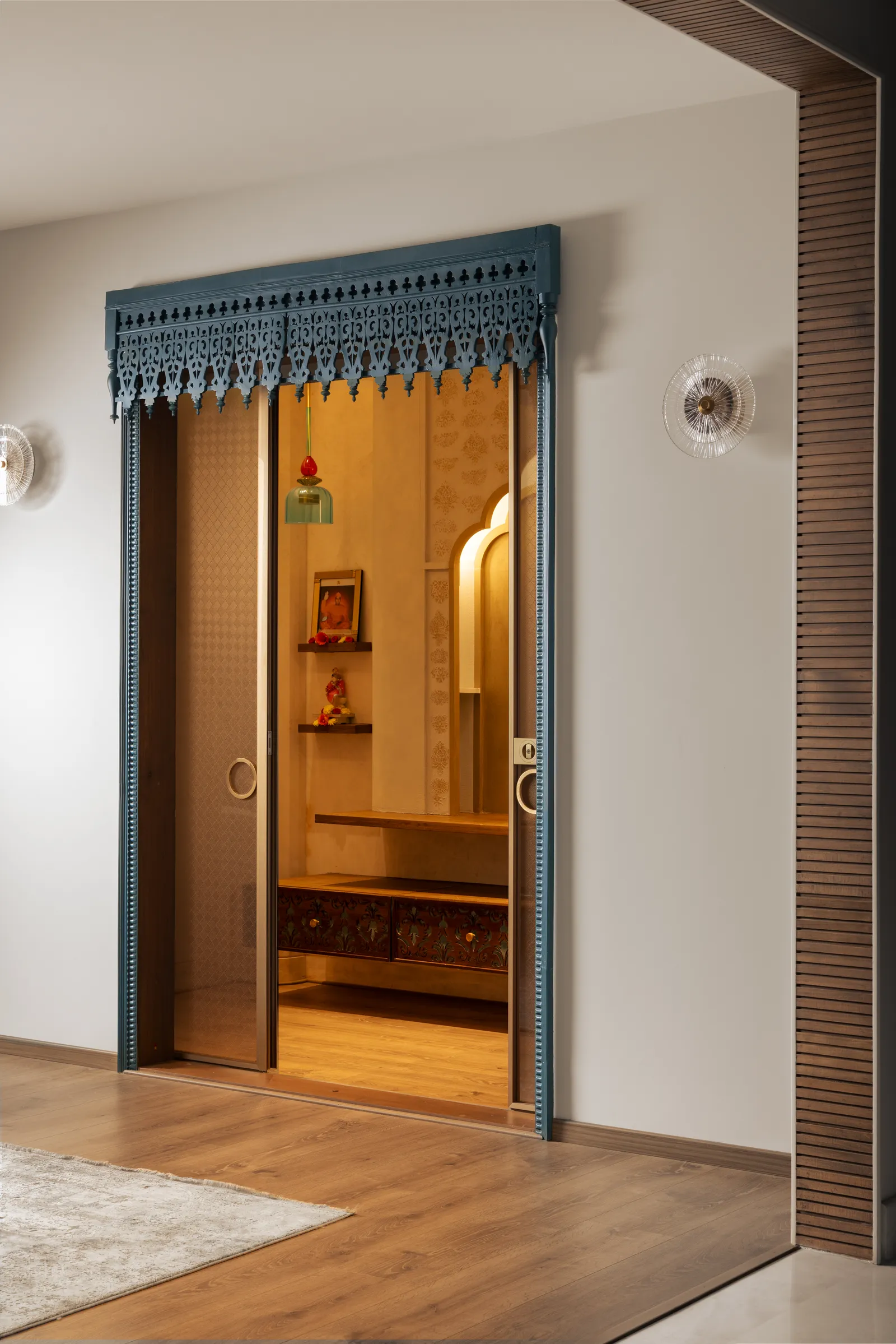 Pooja room entrance with walnut frame and fabric valance — Seema Katta Svasa